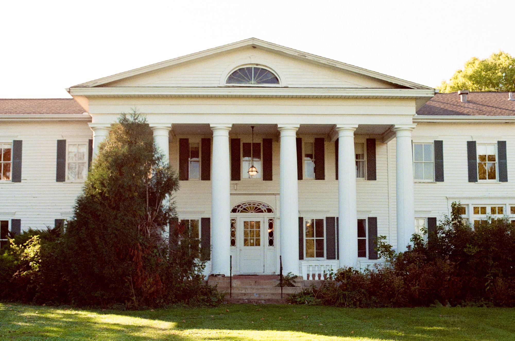 The columned front portico of Cedarhurst Mansion in Cottage Grove, Minnesota